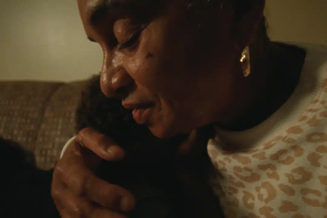 grandmother holding grandchild closely in embrace. Mission Partners